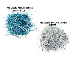 May include: Two piles of metallic shredded gift box filler. One pile is light blue and the other is silver.