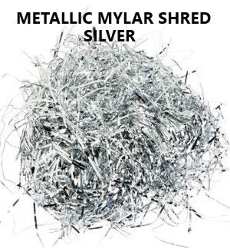 May include: Silver metallic mylar shred for packaging or crafts. The shred is made of thin, shiny strips of mylar.