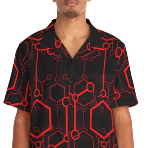 May include: A black short-sleeved button-down shirt with a red geometric pattern of hexagons and circles.