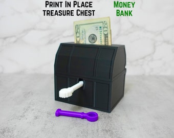 3D Printed Treasures Chest Money Bank with Key.   Primary color is Treasure Chest.  Secondary Color is Key