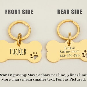 May include: Gold bone-shaped dog tag with a key ring. The front side is engraved with the name "TUCKER". The back side is engraved with "I'm lost Call my mum 123-456-789".