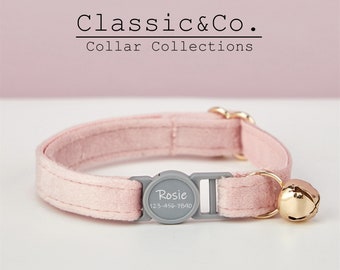 May include: A pink velvet cat collar with a gray buckle and a gold bell. The buckle has a white label with the name "Rosie" and a phone number.
