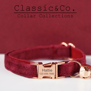 May include: Burgundy velvet cat collar with a rose gold buckle and bell. The buckle has the name "Hattie" and phone number "123-456-7890" engraved on it.