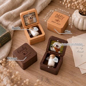 May include: Square wooden keepsake boxes with hinged lids featuring photo inserts and engraved names. Each box contains a small glass bottle with a cork stopper and a heart-shaped metal tag. Dimensions are 2.16 inches by 2.16 inches by 1.49 inches.