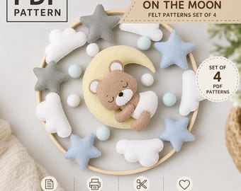 May include: A PDF pattern set of 4 featuring a felt baby bear on a yellow moon, surrounded by gray and light blue stars, white clouds, and small light blue felt balls, all suspended from a circular wooden hoop for a mobile craft project.