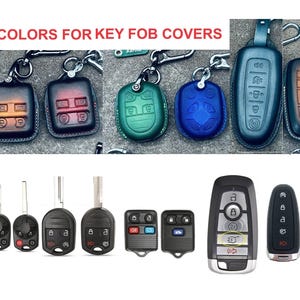 May include: An assortment of key fobs and key fob covers in various colors. The image includes key fobs with and without covers, showcasing different designs and button layouts. Text at the top reads "50 COLORS FOR KEY FOB COVERS."