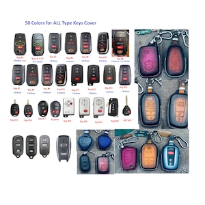 May include: A collection of various car key fobs and protective key covers in multiple shapes, sizes, and colors. The image displays numerous black plastic key remotes labeled with numbers and text, alongside leather-style key cases with metal key rings.
