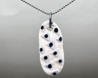 Colgante de triángulos