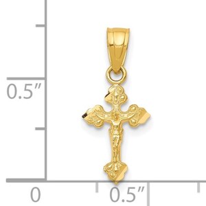 May include: A gold crucifix pendant. The pendant shows a detailed depiction of Jesus on the cross. The cross measures approximately 1.3 cm in length and is suspended from a small loop.