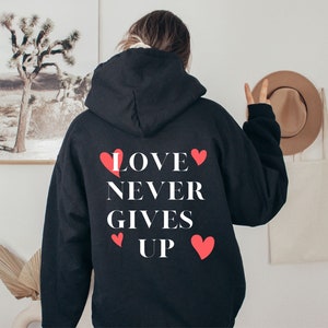 Love never gives up - red valentines | women&#39;s hoodie, trendy sweatshirt, vsco hoodie, cute hoodies, oversized hoody, tumblr, positivity