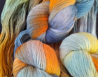 Hand dyed nylon free sock yarn: sock weight 4ply "Shoreline" 100g/400m yarn, yellow/orange/blue tones, 80/20 Merino and Lincoln wool yarn
