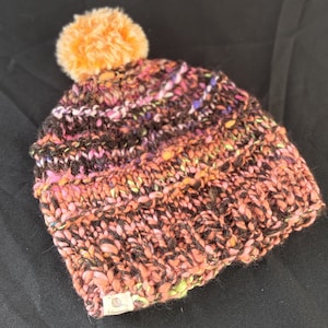 Handknitted children&#39;s beanie from hand spun yarn with faux fur pom pom, wool and silk beanie, orange pom pom on multicoloured beanie