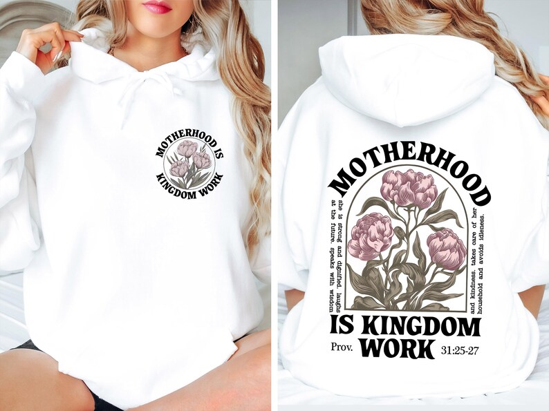 May include: White hoodie with the text "MOTHERHOOD IS KINGDOM WORK" and a floral design. The design is on the front and back of the hoodie. The back design includes the text "Prov. 31:25-27".
