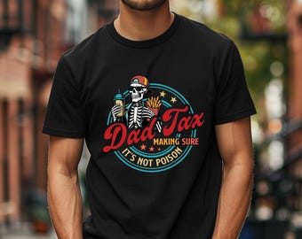 May include: Black t-shirt with a graphic featuring a skeleton wearing a cap, holding a drink and fries. The design includes the words "Dad Tax" in red script, with the phrase "Making Sure It's Not Poison" in a circular blue design.