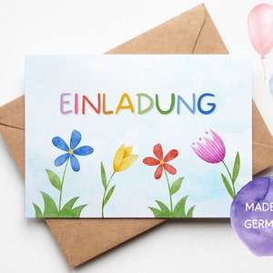 May include: A colorful invitation card with the word "EINLADUNG" in rainbow letters. The card features a blue flower, a yellow tulip, a red flower, and a pink tulip on a light blue background with clouds. The card has a purple watercolor background with the text "MADE IN GERMANY".