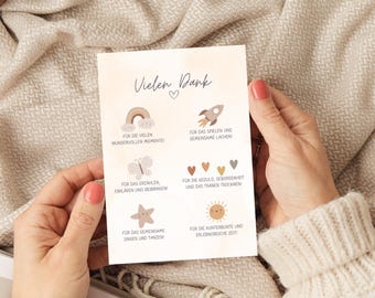 May include: A card with the text "Vielen Dank" and illustrations of a rainbow, rocket, butterfly, heart, star, and sun. The text below each illustration describes the reason for the thank you, such as "for the many wonderful moments" and "for the colorful and eventful time".