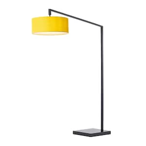 May include: A modern floor lamp with a black metal frame and a bright yellow lampshade. The lampshade is cylindrical and casts a warm glow. The lamp has a square base and a minimalist design.