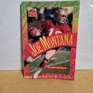 May include: A Sports Illustrated Kids book cover featuring Joe Montana in a red and gold football uniform. The cover has a red banner with the name "JOE MONTANA" in yellow letters. The background is a photo of a football field.
