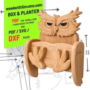 May include: A wooden owl-shaped box and planter, featuring a carved owl face and claw-like supports. The planter is approximately 8.6 inches (22 cm) tall. The design includes text: woodart513jm.etsy.com, BOX & PLANTER, PDF, SVG, and DXF files.