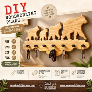 May include: A light-colored wooden wall-mounted key holder featuring a cutout silhouette of a bear family. The piece includes seven black metal hooks, each holding a set of keys. Text on the image includes DIY WOODWORKING PLANS, PDF, SVG, DXF, PNG.