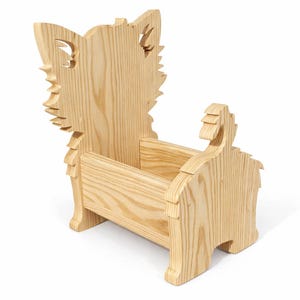 May include: A wooden book holder shaped like a dog. The light-colored wood has a natural grain. The dog's head and tail are part of the design, with cut-out details. The holder is designed to hold books upright.