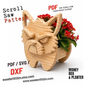 May include: A wooden scroll saw pattern for a planter shaped like a cartoon animal. The planter is filled with red flowers. Text on the image includes "Scroll Saw Pattern", "PDF", "PDF/SVG/DXF", and website addresses.