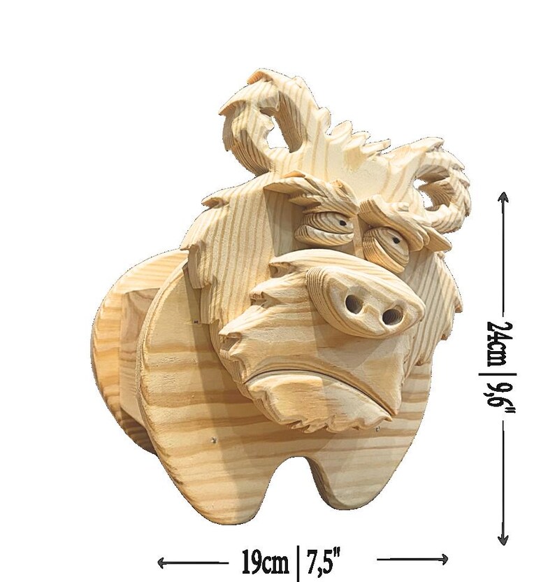 May include: A wooden sculpture of a bull with a detailed, carved design. The sculpture is 9.6 inches tall and 7.5 inches wide. The bull has horns, a snout, and expressive eyes. The wood has a natural, light brown color.
