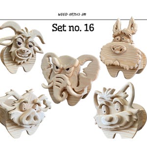 以下が含まれることがあります： 表情豊かな彫刻が施された、木製の動物の顔のセット。各顔はユニークなデザインで、木材の自然な仕上がりです。「Set no. 16」の文字が動物の顔の上に表示されています。