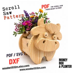 May include: A wooden cow-shaped planter with a bouquet of colorful flowers. The planter has a rustic design and is made from light-colored wood. Text on the image includes "Scroll Saw Pattern", "PDF", "PDF / SVG / DXF", "Money Box & Planter", and website addresses.