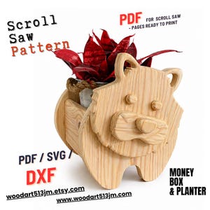 May include: A wooden lion-shaped planter with a small metal bucket holding a red plant. The planter is made from light-colored wood and features the text "Scroll Saw Pattern", "PDF", "Money Box & Planter", and website addresses.