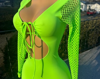 May include: A neon green one-piece bodysuit with a mesh long-sleeve top. The bodysuit has a plunging neckline with a tie detail and a cutout at the waist.