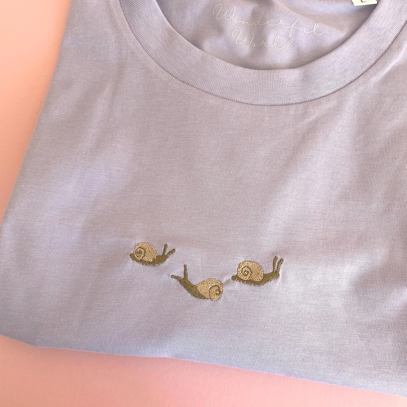 Snail T-Shirt with snails embroidered.