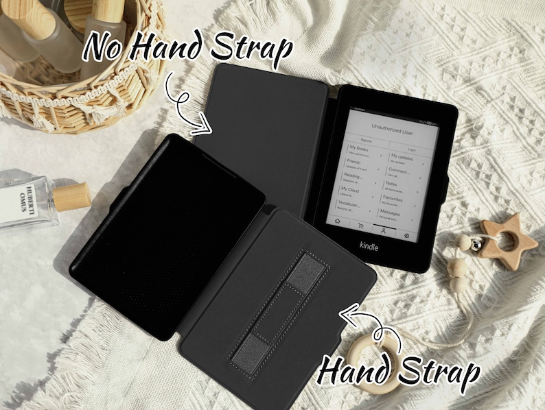 May include: Two black Kindle e-reader cases, one with a hand strap and one without. The case with the hand strap has a black strap with a gray textured surface. The case without the hand strap is open and shows the black interior.