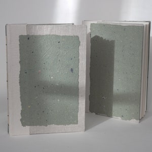 Handmade A5 sketchbook green Longstitch binding, with handmade paper, linen on the cover