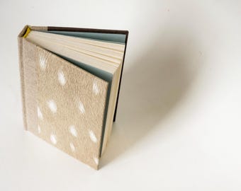 Spotted fawn pattern Hardcover notebook in A6 format, natural white, grid paper