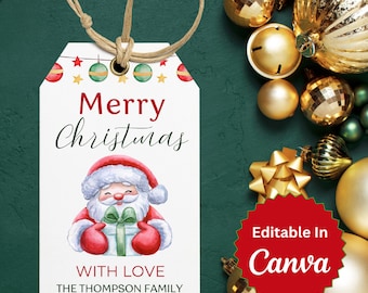 May include: A white gift tag with a red and green Christmas theme. It features a cartoon Santa Claus holding a wrapped gift. The text reads "Merry Christmas" and "With Love, The Thompson Family".