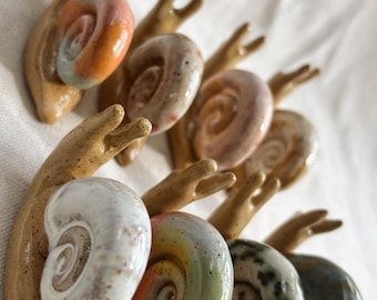Caracoles de cerámica: soportes para anillos, accesorios para plantas, adornos.
