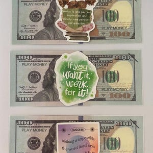 May include: Three motivational stickers on a background of US $100 bills. The first sticker features a cartoon girl with pigtails and the text "Genius is one percent inspiration and ninety nine percent perspiration". The second sticker is green and features the text "If you want it, work for it!" The third sticker is a rainbow gradient with the text "SUCCESS + nothing is impossible the word itself says "i'm possible!"