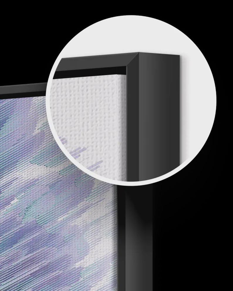 May include: Close-up of a framed canvas art piece. The artwork features a blend of blue and purple brushstrokes. The canvas is set within a sleek, black frame, creating a modern aesthetic.