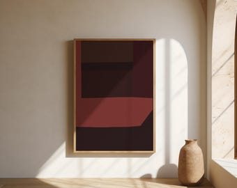 May include: A rectangular wall art piece in a light wood frame featuring an abstract composition of solid, layered geometric shapes in deep shades of burgundy, dark maroon, and black, creating a bold, layered visual effect on the canvas.