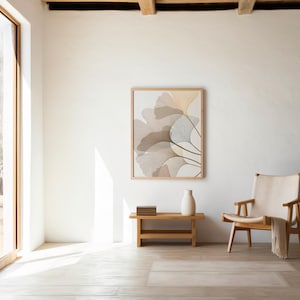 May include: A light-filled room with a large window and a framed botanical print. A wooden bench holds a stack of books and a white vase. A wooden chair with a cream-colored throw is positioned nearby, creating a serene and minimalist aesthetic.