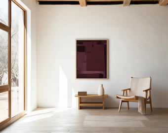 Puede incluir: Una pieza de arte mural rectangular con formas geométricas abstractas en tonos burdeos profundo y morado oscuro, enmarcada en madera clara. La obra se exhibe en una pared blanca sobre un banco de madera con libros y un jarrón de cerámica.