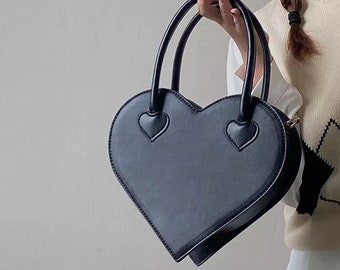 pink heart shaped purse