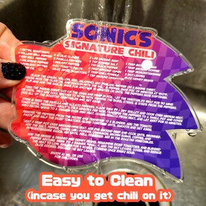 May include: A clear, star-shaped recipe card for Sonic's Signature Chili, with a red and purple gradient design. The card features a detailed chili recipe with ingredient measurements and the text "Easy to Clean".