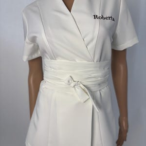 Luxurious healthcare professional tunic and trousers with embroidery, with an additional belt