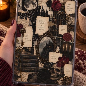 May include: A clear protective tablet case featuring a dark collage design with a moon, moth, skull, vintage key, ornate mirror, and books. Text includes: A quieter mind a kinder world, still here still becoming, same soul different chapter, and more stories to live.