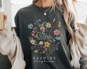 Growing A Tiny Human Wildflower Comfort Colors Shirt Floral Im Pregnant Daughter Expecting Mom Gift Pregnancy Reveal Baby Announcement Ideas
