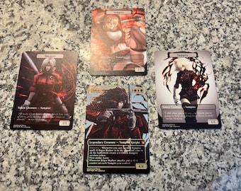 May include: Four custom-designed trading cards featuring illustrations of vampires. The cards are printed on a black background with red and white accents. The text on the cards includes the words "Vampire", "Token Creature", "Legendary Creature", and "Vampire Knight".