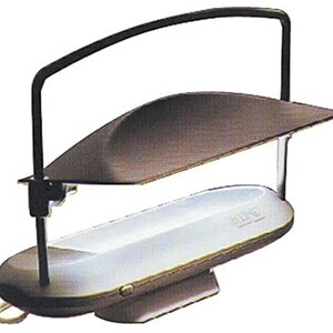 May include: A black lamp with a curved arm and a white shade. The lamp has a white base with the word "ULINE" printed on it.