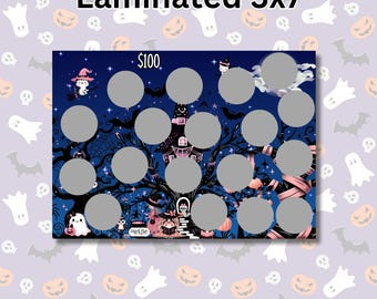 May include: A laminated 5x7 inch Halloween-themed scratch-off card with a spooky tree, a witch's house, and a $100 prize. The card has 35 circles that can be scratched off to reveal prizes.